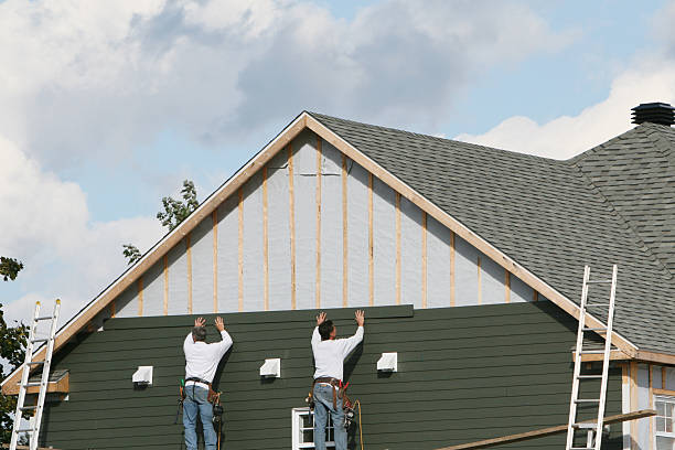 Professional Storm Damage Siding Repair technician working in Mills River, NC